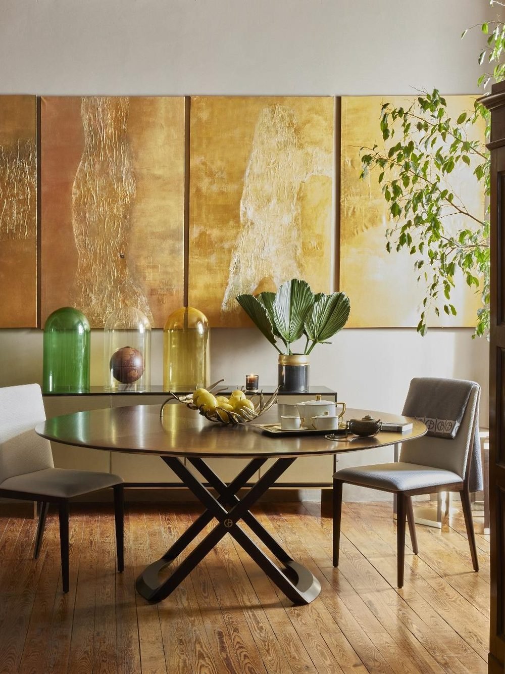 Dining room in neutral tones with gold panels
